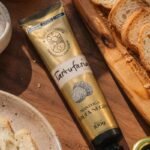 Tartuferia San Paolo e IBÁ Brasil lançam manteiga com trufas em nova collab gastronômica  Criação une a experiência da Tartuferia com trufas à cozinha da chef Izabela Dolabela em um produto pensado para levar o ingrediente para receitas do dia a dia